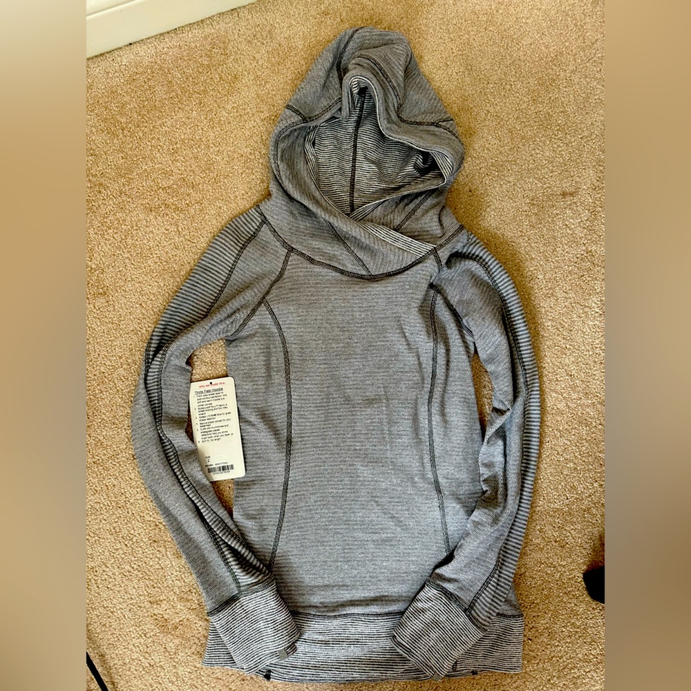 Like new Lululemon Think Fast Hoodie in size 2. Grey